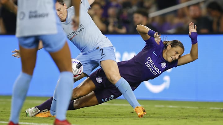 Sep 28, 2024; Orlando, Florida, USA; Orlando Pride defender Kylie Strom (3) collides with Houston Dash defender Allysha Chapman (2) during the second half at Inter&Co Stadium. Mandatory Credit: Russell Lansford-Imagn Images