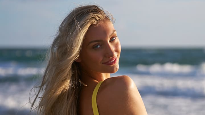 Cameron Brink was photographed by Ben Horton at The Boca Raton. Swimsuit by Andi Bagus. Swimsuit embroidered by Abbode.