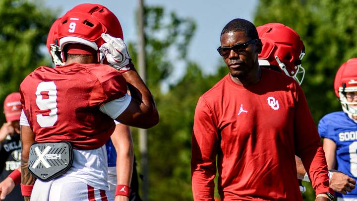 Oklahoma running backs coach Deland McCullough gives instruction to Lloyd Avant during practice. Oklahoma running backs coach Deland McCullough gives instruction to Lloyd Avant during practice.