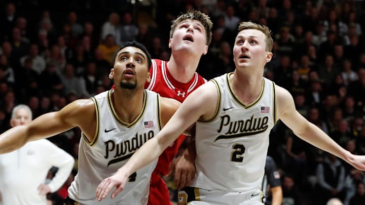 Purdue Boilermakers forward Trey Kaufman-Renn and guard Fletcher Loyer box out Wisconsin Badgers forward Nolan Winter