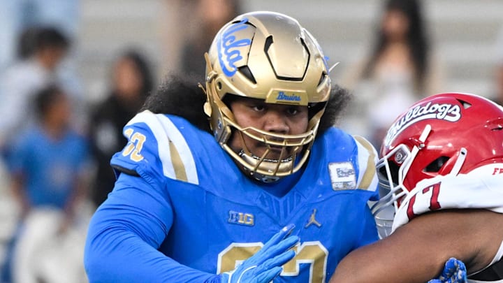 Nov 30, 2024; Pasadena, California, USA; UCLA Bruins defensive lineman Jay Toia (93) tangles with Fresno State Bulldogs offensive lineman Toreon Penright (77) during the fourth quarter at Rose Bowl. Mandatory Credit: Robert Hanashiro-Imagn Images Nov 30, 2024; Pasadena, California, USA; UCLA Bruins defensive lineman Jay Toia (93) tangles with Fresno State Bulldogs offensive lineman Toreon Penright (77) during the fourth quarter at Rose Bowl. Mandatory Credit: Robert Hanashiro-Imagn Images