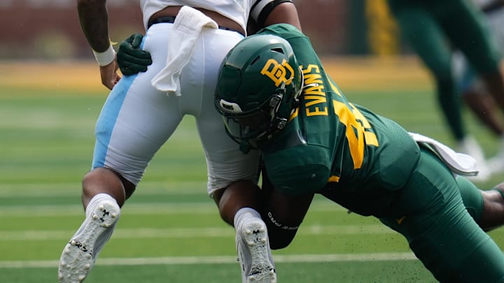 Long Island Sharks quarterback Maurice Smith (6) is tackled by Baylor Bears linebacker Jeremy Evans (42) during the second half at McLane Stadium.