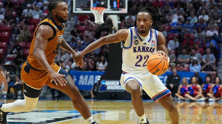 Mar 20, 2026; San Diego, CA, USA; Kansas Jayhawks guard Darryn Peterson (22) controls the ball against California Baptist Lancers guard Martel Williams (33) in the first half during a first round game of the men's 2026 NCAA Tournament at Viejas Arena. Mandatory Credit: Kirby Lee-Imagn Images Mar 20, 2026; San Diego, CA, USA; Kansas Jayhawks guard Darryn Peterson (22) controls the ball against California Baptist Lancers guard Martel Williams (33) in the first half during a first round game of the men's 2026 NCAA Tournament at Viejas Arena. Mandatory Credit: Kirby Lee-Imagn Images