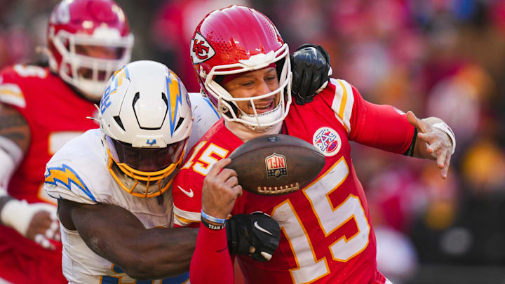 Dec 14, 2025; Kansas City, Missouri, USA; Los Angeles Chargers linebacker Odafe Oweh (98) sacks Kansas City Chiefs quarterback Patrick Mahomes (15) during the second half at GEHA Field at Arrowhead Stadium. Mandatory Credit: Jay Biggerstaff-Imagn Images