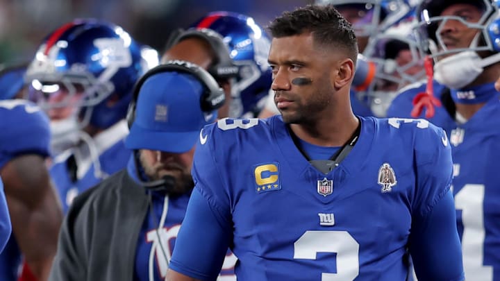 Oct 9, 2025; East Rutherford, New Jersey, USA; New York Giants quarterback Russell Wilson (3) watches from the sidelines during the second quarter against the Philadelphia Eagles at MetLife Stadium. Mandatory Credit: Brad Penner-Imagn Images