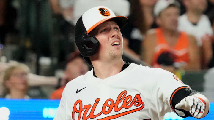 Jul 29, 2025; Baltimore, Maryland, USA; Baltimore Orioles catcher Adley Rutschman (35) connects for a double to drive in the go ahead run during the eighth inning against the Toronto Blue Jays at Oriole Park at Camden Yards. Mandatory Credit: Mitch Stringer-Imagn Images