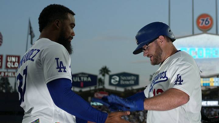 Los Angeles Dodgers third baseman Max Muncy (13) is congratulated by left fielder Teoscar Hernandez (37) after hitting a two-run home run in the first inning against the Pittsburgh Pirates at Dodger Stadium on Aug. 21, 2026.