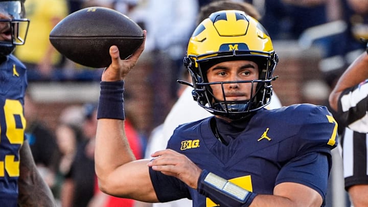 Michigan quarterback Mikey Keene (7) warms up ahead of the New Mexico game at Michigan Stadium in Ann Arbor on Saturday, August 30, 2025. Michigan quarterback Mikey Keene (7) warms up ahead of the New Mexico game at Michigan Stadium in Ann Arbor on Saturday, August 30, 2025.
