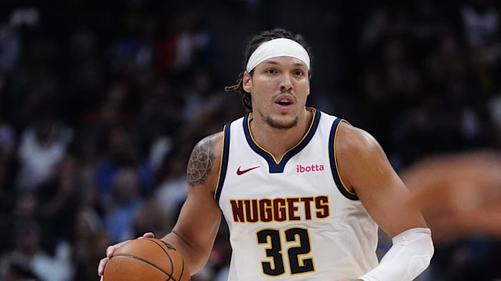 Nov 5, 2025; Denver, Colorado, USA; Denver Nuggets forward Aaron Gordon (32) dribbles the ball in the second quarter against the Miami Heat at Ball Arena.