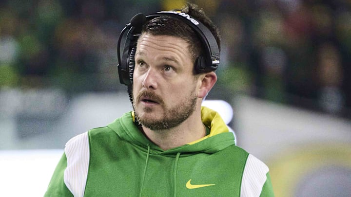 Nov 19, 2022; Eugene, Oregon, USA; Oregon Ducks head coach Dan Lanning looks up while going through game notes during the first half against the Utah Utes at Autzen Stadium. Mandatory Credit: Troy Wayrynen-Imagn Images