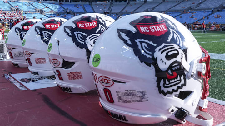 Sep 7, 2024; Charlotte, North Carolina, USA; North Carolina State Wolfpack helmets during pregame activity for the Dukes Mayo Classic against the Tennessee Volunteers at Bank of America Stadium. Mandatory Credit: Jim Dedmon-Imagn Images