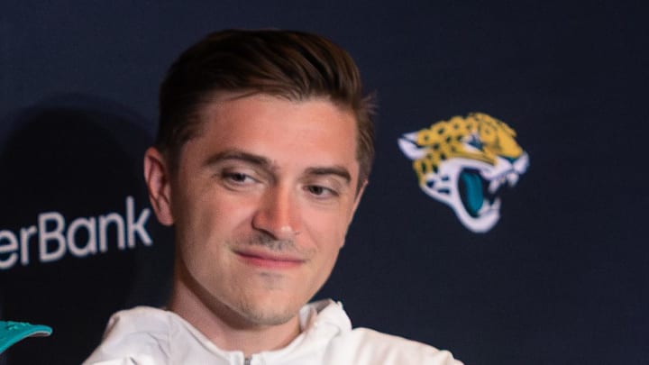 Apr 25, 2025; Jacksonville, FL, USA; Jacksonville Jaguars first round draft pick Travis Hunter talks to the media beside head coach Liam Coen and general manager James Gladstone during a press conference at Miller Electric Center. Mandatory Credit: Travis Register-Imagn Images