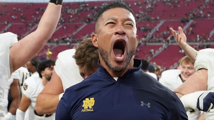 Nov 30, 2024; Los Angeles, California, USA; Notre Dame Fighting Irish head coach Marcus Freeman celebrates with players at the end of the game against the Southern California Trojans at United Airlines Field at Los Angeles Memorial Coliseum. Nov 30, 2024; Los Angeles, California, USA; Notre Dame Fighting Irish head coach Marcus Freeman celebrates with players at the end of the game against the Southern California Trojans at United Airlines Field at Los Angeles Memorial Coliseum.