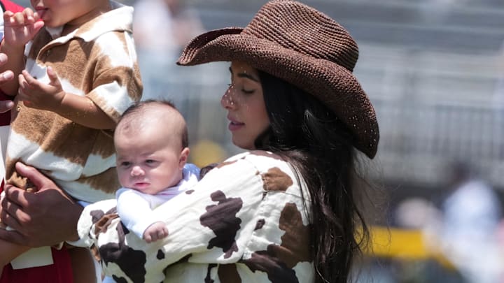 Dallas Cowboys quarterback Dak Prescott's fiancée Sarah Jane Ramos and daughter Aurora Prescott during training camp 
