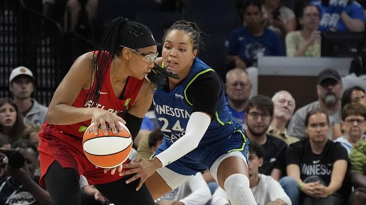 Jul 27, 2025; Minneapolis, Minnesota, USA; Minnesota Lynx forward Napheesa Collier (24) defends against Atlanta Dream guard Allisha Gray (15) in the third quarter at Target Center. Mandatory Credit: Bruce Kluckhohn-Imagn Images