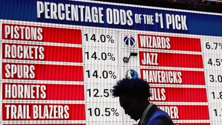 May 16, 2023; Chicago, IL, USA; People walk past the 2023 NBA Draft Lottery board at McCormick Place