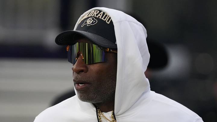 Sep 19, 2026; Evanston, Illinois, USA;  Colorado Buffaloes head coach Deion Sanders takes the field with his team for warmups before the game against the Northwestern Wildcats at Northwestern Medicine Field at Martin Stadium.  Mandatory Credit: David Banks-Imagn Images