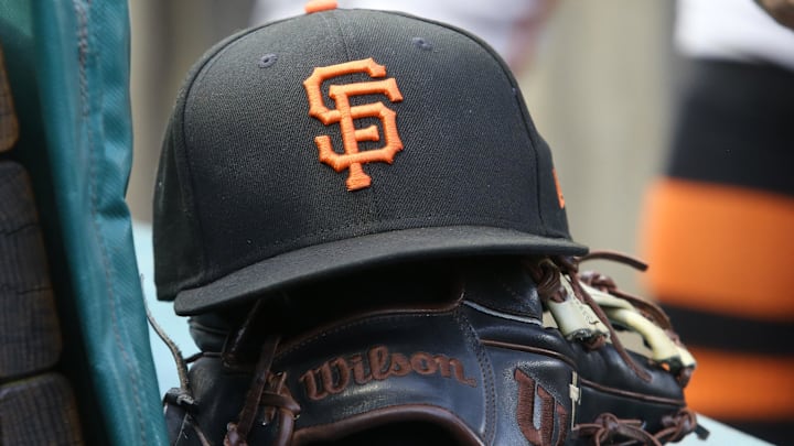Jul 14, 2023; Pittsburgh, Pennsylvania, USA;  San Francisco Giants hat and glove on the bench against the Pittsburgh Pirates during the first inning at PNC Park.