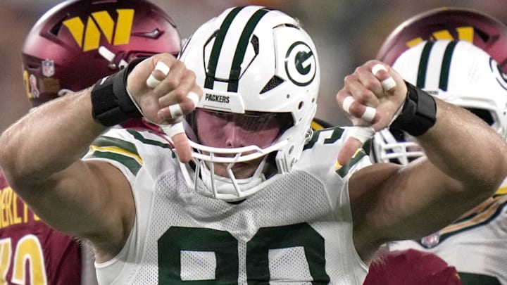 Green Bay Packers defensive end Lukas Van Ness celebrates after tackling Washington Commanders running back Austin Ekeler.
