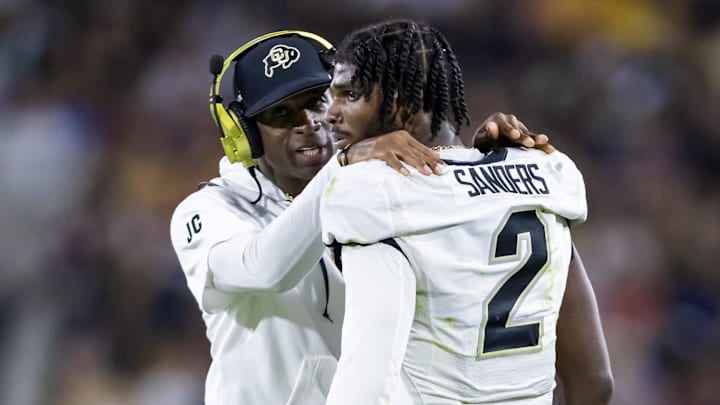 Colorado Buffaloes head coach Deion Sanders with son and quarterback Shedeur Sanders against the Arizona State Sun Devils.