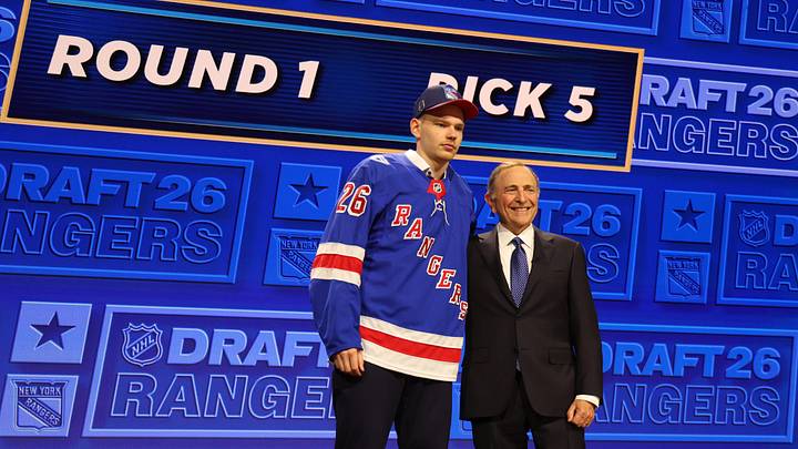 Jun 26, 2026; Buffalo, New York, USA; Alberts Smits reacts beside NHL commissioner Gary Bettman after being selected with the fifth pick in the first round of the 2026 NHL Draft by the New York Rangers at KeyBank Center. Mandatory Credit: Timothy T. Ludwig-Imagn Images