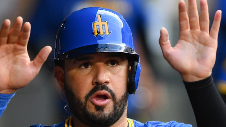 Seattle Mariners third baseman Eugenio Suarez (28) celebrates in the dugout after scoring a run against the Texas Rangers during the fourth inning at T-Mobile Park on July 31. 