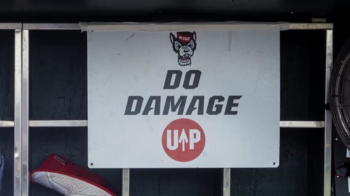 Jun 17, 2024; Omaha, NE, USA; NC State Wolfpack shortstop Brandon Butterworth (3) walks through the dugout before the game against the Florida Gators at Charles Schwab Field Omaha. Mandatory Credit: Dylan Widger-Imagn Images