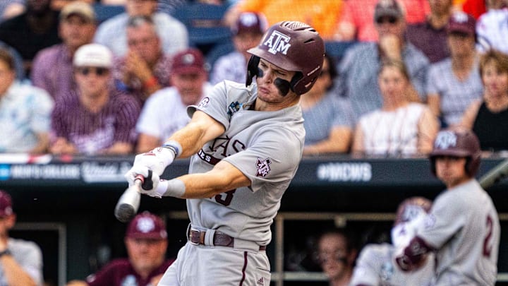 Texas A&M Aggies left fielder Caden Sorrell (13) hits an RBI single against the Tennessee Volunteers during the first inning at Charles Schwab Field Omaha.