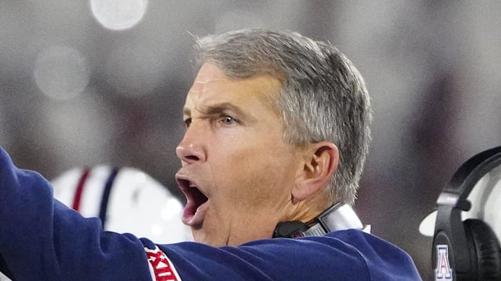 Arizona head coach Brent Brennan celebrates defensive back Genesis Smith (12) during a game against Arizona State at Mountain America Stadium in Tempe on Nov. 28, 2025.