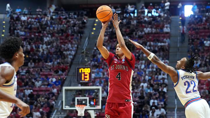 Mar 22, 2026; San Diego, CA, USA; St. John's Red Storm guard Oziyah Sellers (4) shoots against Kansas Jayhawks guard Darryn Peterson (22) in the first half during a second round game of the men's 2026 NCAA Tournament at Viejas Arena.