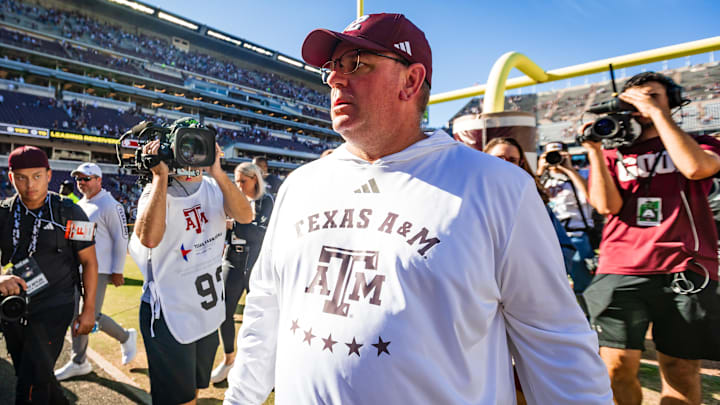 Texas A&M Aggies head coach Mike Elko walks off the field after defeating the Samford Bulldogs.