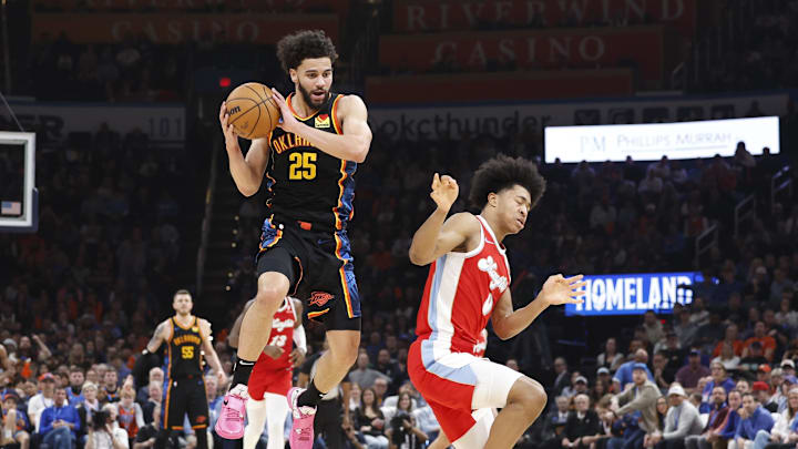 Dec 29, 2024; Oklahoma City, Oklahoma, USA; Oklahoma City Thunder guard Ajay Mitchell (25) grabs a pass over Memphis Grizzlies forward Jaylen Wells (0) during the second quarter at Paycom Center. Mandatory Credit: Alonzo Adams-Imagn Images Dec 29, 2024; Oklahoma City, Oklahoma, USA; Oklahoma City Thunder guard Ajay Mitchell (25) grabs a pass over Memphis Grizzlies forward Jaylen Wells (0) during the second quarter at Paycom Center. Mandatory Credit: Alonzo Adams-Imagn Images