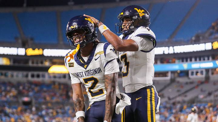 Sep 19, 2026; Charlotte, North Carolina, USA; West Virginia Mountaineers wide receiver DJ Epps (2) celebrates with West Virginia Mountaineers quarterback Michael Hawkins Jr. (3) after catching a touchdown during the third quarter against the Virginia Cavaliers at Bank of America Stadium. Mandatory Credit: Ben Queen-Imagn Images Sep 19, 2026; Charlotte, North Carolina, USA; West Virginia Mountaineers wide receiver DJ Epps (2) celebrates with West Virginia Mountaineers quarterback Michael Hawkins Jr. (3) after catching a touchdown during the third quarter against the Virginia Cavaliers at Bank of America Stadium. Mandatory Credit: Ben Queen-Imagn Images
