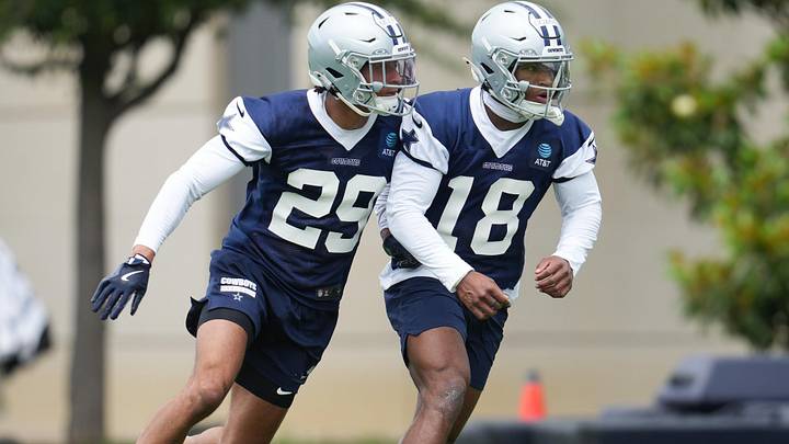 Dallas Cowboys cornerback Devin Moore and Dallas Cowboys safety Caleb Downs go through a drill during practice. Dallas Cowboys cornerback Devin Moore and Dallas Cowboys safety Caleb Downs go through a drill during practice.