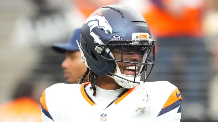 Dec 7, 2025; Paradise, Nevada, USA;  Denver Broncos cornerback Jahdae Barron (23) and Las Vegas Raiders head coach Pete Carroll interact prior to a game at Allegiant Stadium. Mandatory Credit: Stephen R. Sylvanie-Imagn Images