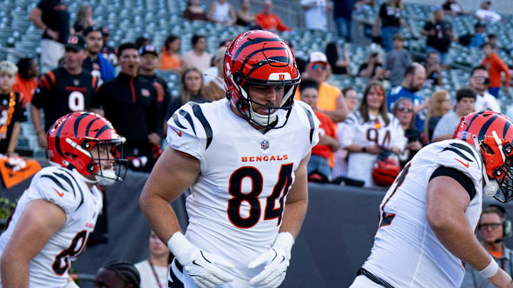 Cincinnati Bengals tight end Tanner McLachlan (84) Cincinnati Bengals tight end Erick All Jr. (83) and other Cincinnati Bengals run onto the field to warm up before NFL preseason game between the Cincinnati Bengals and the Indianapolis Colts at Paycor Stadium in Cincinnati on Thursday, Aug. 22, 2024.