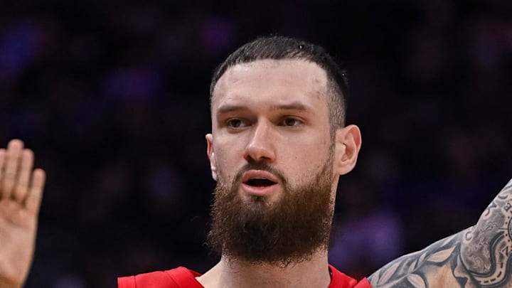 Toronto Raptors forward/center Sandro Mamukelashvili looks to his bench.
