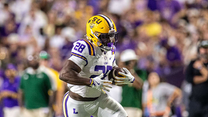 Sep 20, 2025; Baton Rouge, Louisiana, USA; LSU Tigers running back Kaleb Jackson (28) runs against the Southeastern Louisiana Lions during the first half at Tiger Stadium. Mandatory Credit: Stephen Lew-Imagn Images Sep 20, 2025; Baton Rouge, Louisiana, USA; LSU Tigers running back Kaleb Jackson (28) runs against the Southeastern Louisiana Lions during the first half at Tiger Stadium. Mandatory Credit: Stephen Lew-Imagn Images