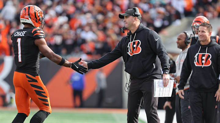 Oct 26, 2025; Cincinnati, Ohio, USA; Cincinnati Bengals wide receiver Ja'Marr Chase (1) shakes hands with head coach Zac Taylor during the fourth quarter against the New York Jets  at Paycor Stadium. Mandatory Credit: Joseph Maiorana-Imagn Images