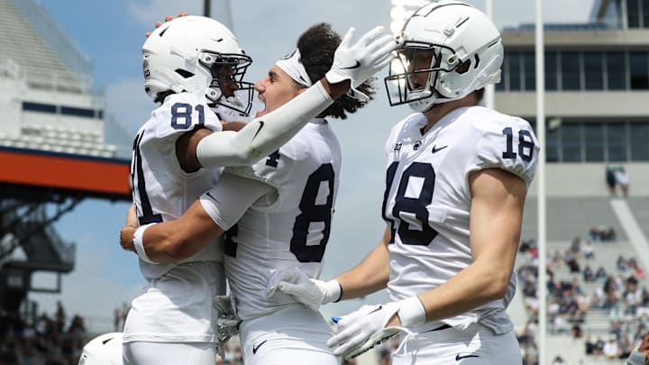 Penn State football wide receiver Lyrick Samuel (81) celebrates with teammates after scoring a touchdown during the Blue White spring game at Beaver Stadium. 