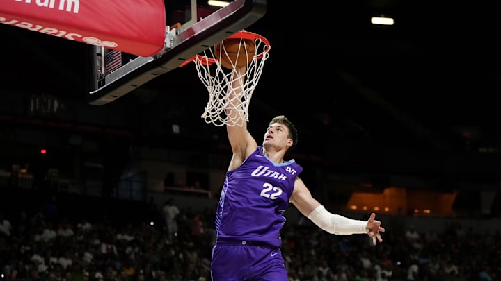 Jul 14, 2025; Las Vegas, NV, USA;  Utah Jazz forward Kyle Filipowski (22) dunks the ball against the San Antonio Spurs during the first half of a NBA basketball game at the Thomas & Mack Center. Mandatory Credit: Lucas Peltier-Imagn Images