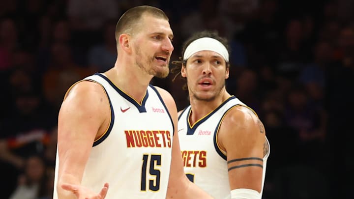 Mar 24, 2026; Phoenix, Arizona, USA; Denver Nuggets center Nikola Jokic (15) and forward Aaron Gordon (32) against the Phoenix Suns at Mortgage Matchup Center. Mandatory Credit: Mark J. Rebilas-Imagn Images
