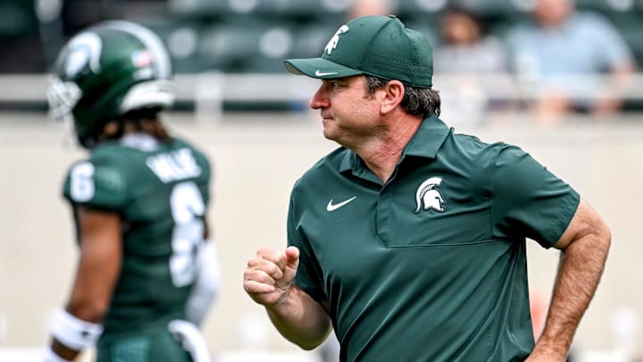 Michigan State's head coach Jonathan Smith jogs back to the sideline before the game against Youngstown State on Saturday, Sept. 13, 2025, at Spartan Stadium in East Lansing.