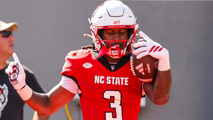 Oct 4, 2025; Raleigh, North Carolina, USA;  NC State Wolfpack running back Hollywood Smothers (3) celebrates a touchdown during the first half of the game against Campbell Fighting Camels at Carter-Finley Stadium. Mandatory Credit: Jaylynn Nash-Imagn Images