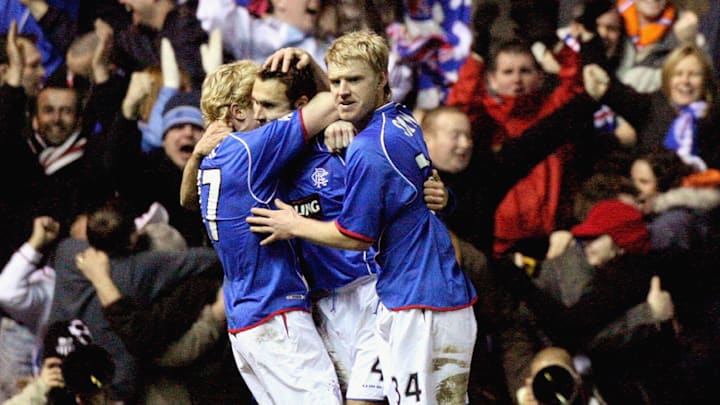 Smith and Burke celebrate together as Rangers players