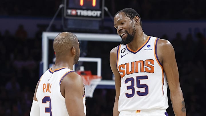 Apr 2, 2023; Oklahoma City, Oklahoma, USA; Phoenix Suns guard Chris Paul (3) and forward Kevin Durant (35) talk during the second half against the Oklahoma City Thunder at Paycom Center. Phoenix won 128-118. Mandatory Credit: Alonzo Adams-Imagn Images