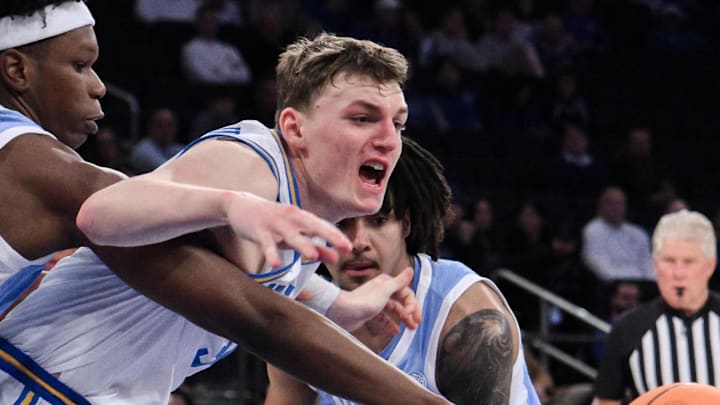 Dec 21, 2024; New York, NY, USA; North Carolina Tar Heels forward Ven-Allen Lubin (22) steals the ball away from UCLA Bruins forward Tyler Bilodeau (34) during the first half at Madison Square Garden. Mandatory Credit: John Jones-Imagn Images