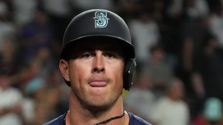 Seattle Mariners second base Dylan Moore (25) scores a run against the Arizona Diamondbacks in the ninth inning at Chase Field on June 9. Seattle Mariners second base Dylan Moore (25) scores a run against the Arizona Diamondbacks in the ninth inning at Chase Field on June 9.