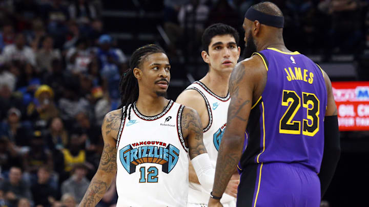 Mar 29, 2025; Memphis, Tennessee, USA; Memphis Grizzlies guard Ja Morant (12) and Los Angeles Lakers forward LeBron James (23) stare at each other during the third quarter at FedExForum. Mandatory Credit: Petre Thomas-Imagn Images Mar 29, 2025; Memphis, Tennessee, USA; Memphis Grizzlies guard Ja Morant (12) and Los Angeles Lakers forward LeBron James (23) stare at each other during the third quarter at FedExForum. Mandatory Credit: Petre Thomas-Imagn Images