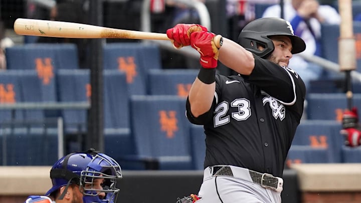 Chicago White Sox left fielder Andrew Benintendi (23) hits against the New York Mets at Citi Field. Chicago White Sox left fielder Andrew Benintendi (23) hits against the New York Mets at Citi Field.